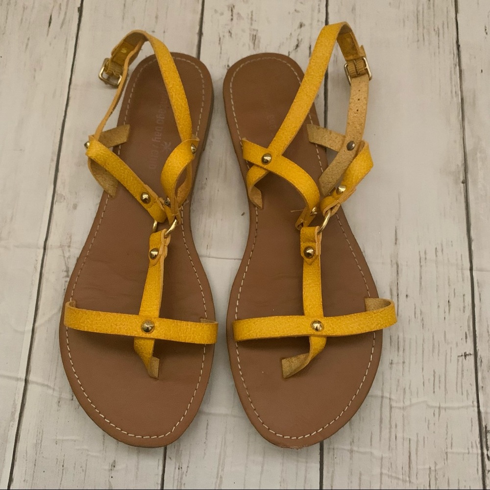 Mustard yellow gladiator sandals with metal studs